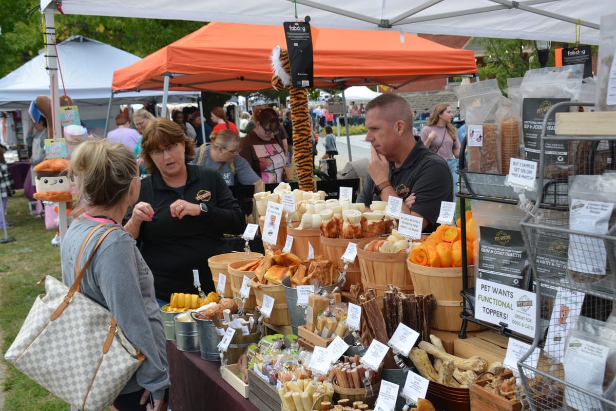 A Pet Wants stand at a community market